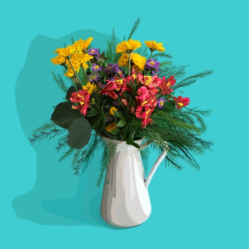 Brightly colored flowers in a white vase