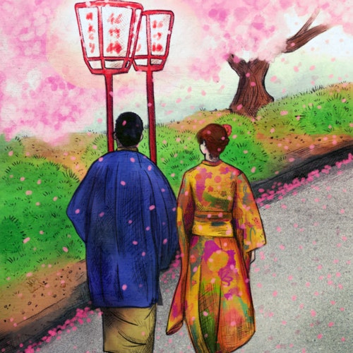 Couple in traditional Japanese clothing walking past blooming cherry blossom trees