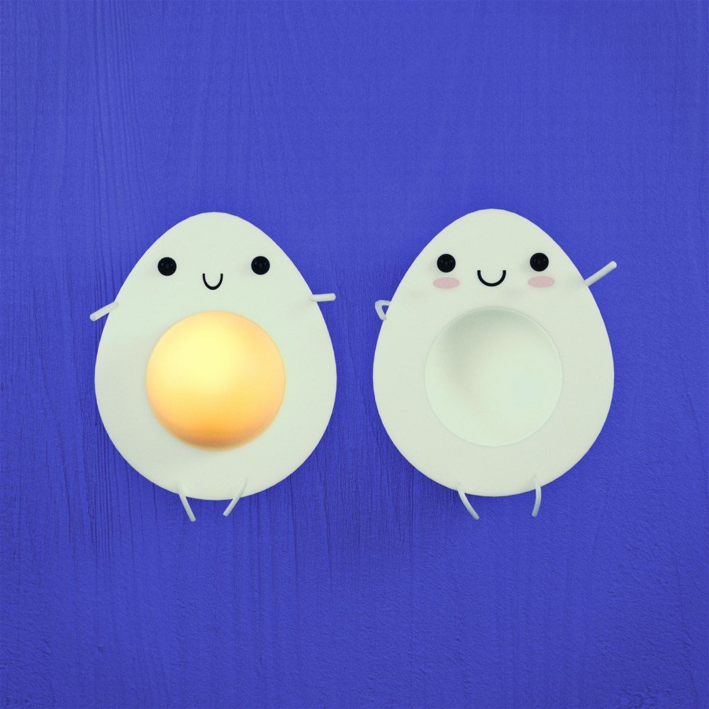 Two halves of an egg with smiling faces and small arms and legs attached