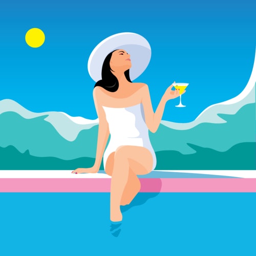 Woman holding a cocktail while sitting at the edge of a swimming pool