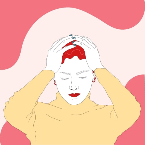 Woman holding her head with both her hands