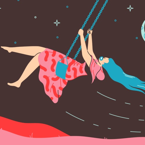 Woman playing on a swing under a night sky