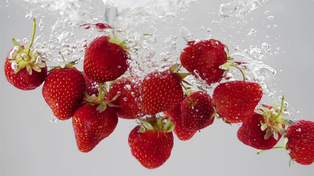 A b togel 888 unch of strawberries falling through water