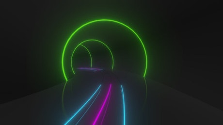 A circular tunnel with neon colors.