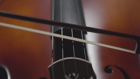 A close up shot of a musician playing a cello.