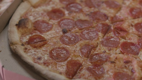 A close-up view of a pepperoni pizza.