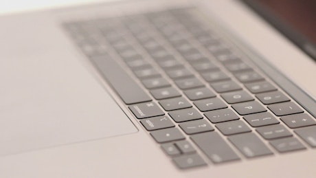 A developer working with a laptop, close up