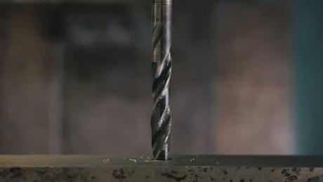 A drilling machine drilling steel.