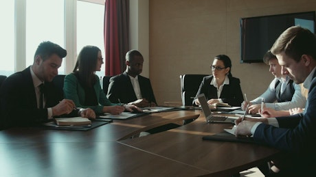 A group of businessmen in a conference room.