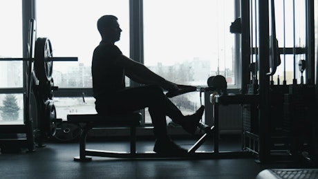 A guy doing exercise at the gym