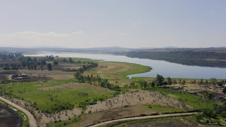 A lake next to agriculture fields
