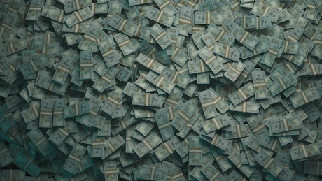 A lot of cash over a rotating background.