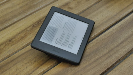 A person reading an ebook on a tablet.