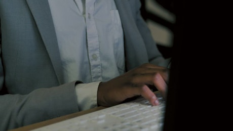 A person typing on a keyboard