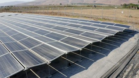 A rural valley's solar power farm view.