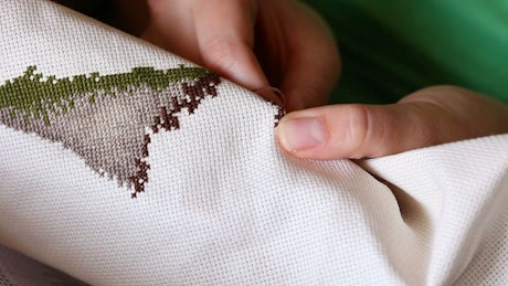 A woman working on embroidery