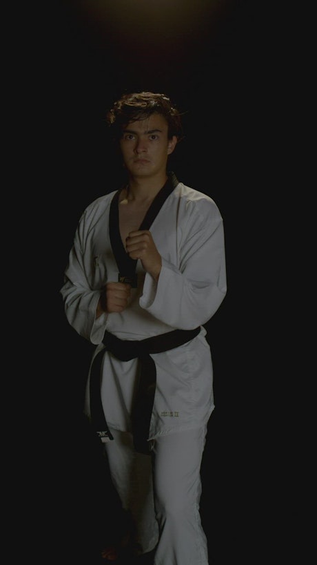 A young man practice karate.
