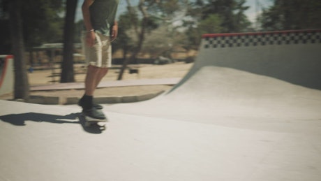 A young man skating in the park.