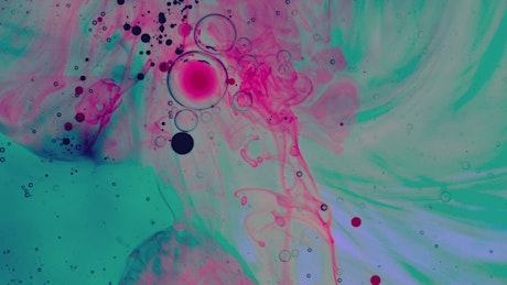 Abstract texture of colored inks in a thick liquid.