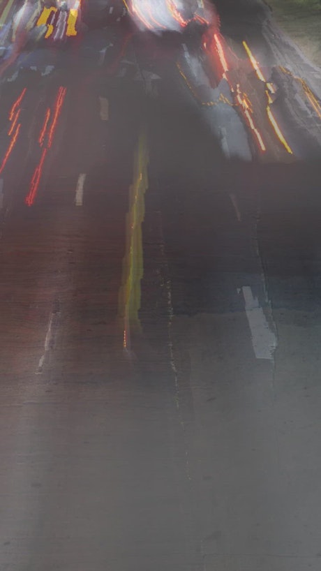 Abstract timelapse of cars in an avenue at dusk.
