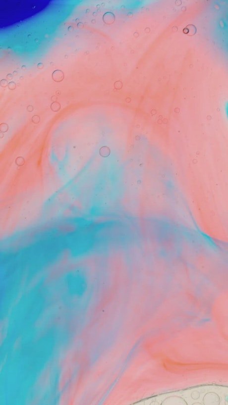 Abstract video of slowly flowing colored inks.