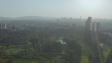 Aerial landscape of a huge city from the top of a park