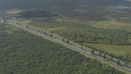 Aerial panorama of a highway that crosses nature.
