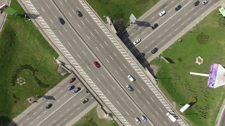 Aerial rotating view of highway junction.