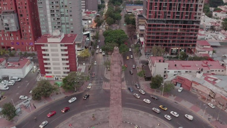 Aerial shot of a large avenue in a city.
