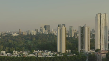 Aerial shot of a large city surrounding a huge park