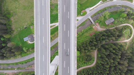 Aerial top view of a concrete highway overpass.