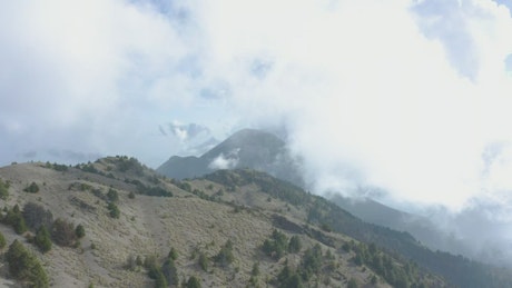 Aerial tour over a mountainous landscape.