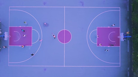 Aerial view of a blue and purple basketball court.
