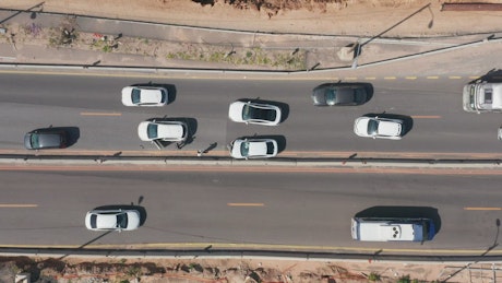 Aerial view of a car accident on a busy highway.