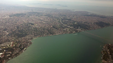 Aerial view of a city and a connecting bridge.