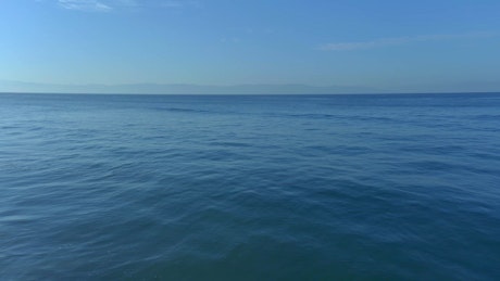 Aerial view of a huge calm blue sea.