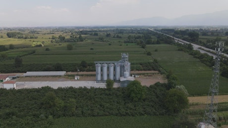 Aerial view of a plain with fields and farms.