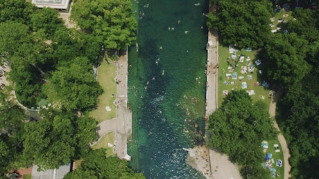 Aerial view of a river with people in and around it
