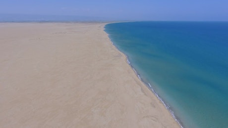 Aerial view of an enormous beach and a blue ocean