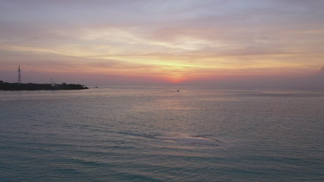 Aerial view of landscape of a calm sea at sunset.