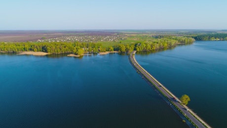 Aerial view of the Dam river with a road crossing it