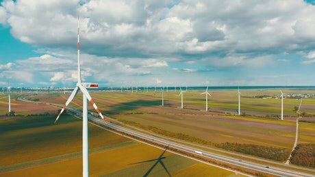 Aerial view of wind turbines in the countryside.