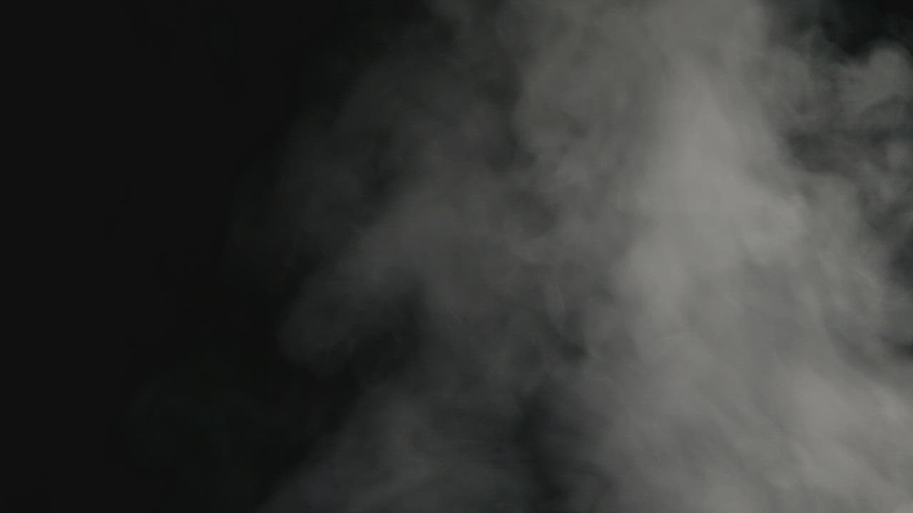 Aggressive smoke on a black background - Free Stock Video