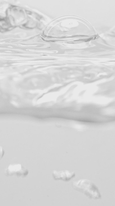 Air bubbles in water rising to the surface.