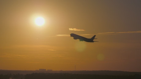 Aircraft taking off against the sun
