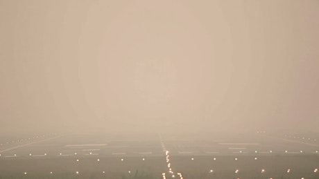 Airplane landing in the fog.