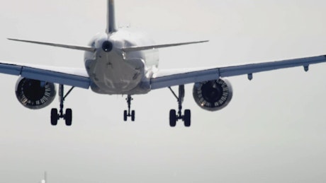 Airplane lands and wheels make smoke