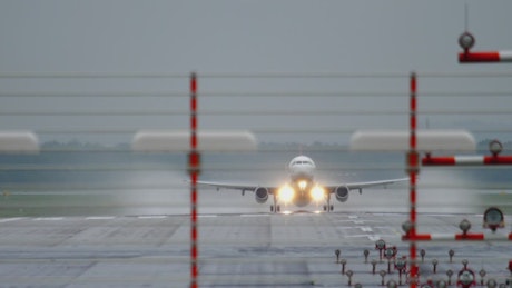 Airplane with lights on takes off.