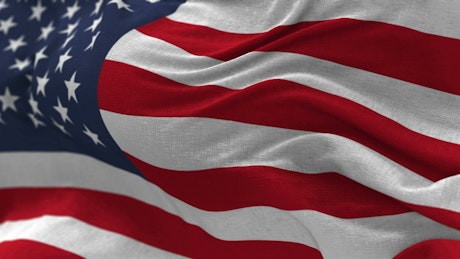 American flag waving in slow motion closeup.