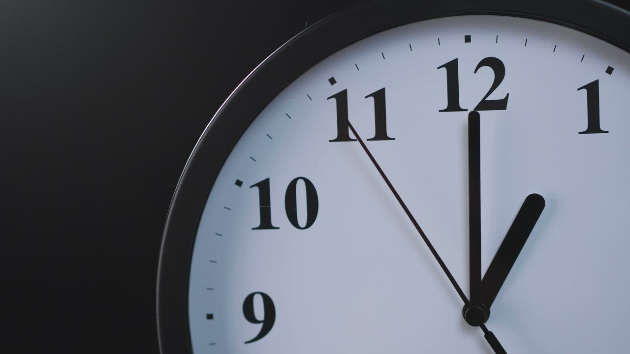 Analog wall clock on a black background in a closed socket - Free Stock  Video